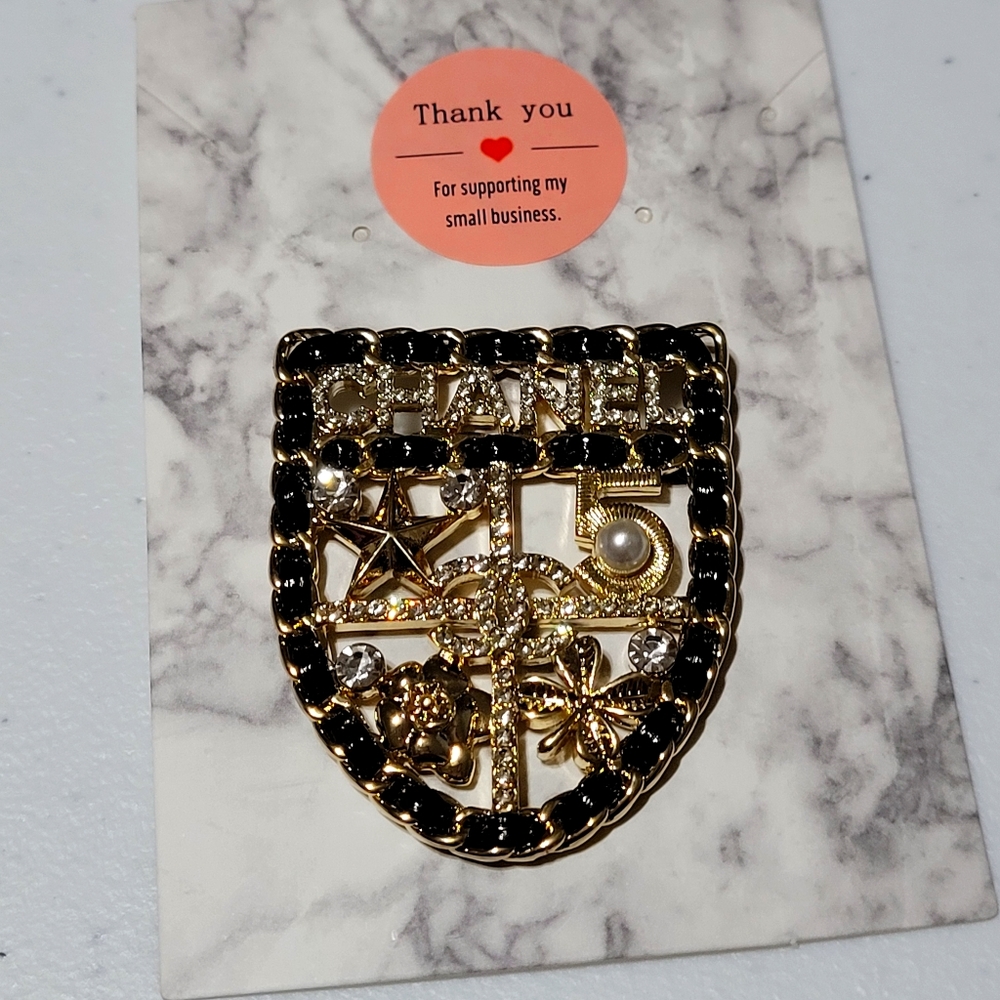 - Brooch